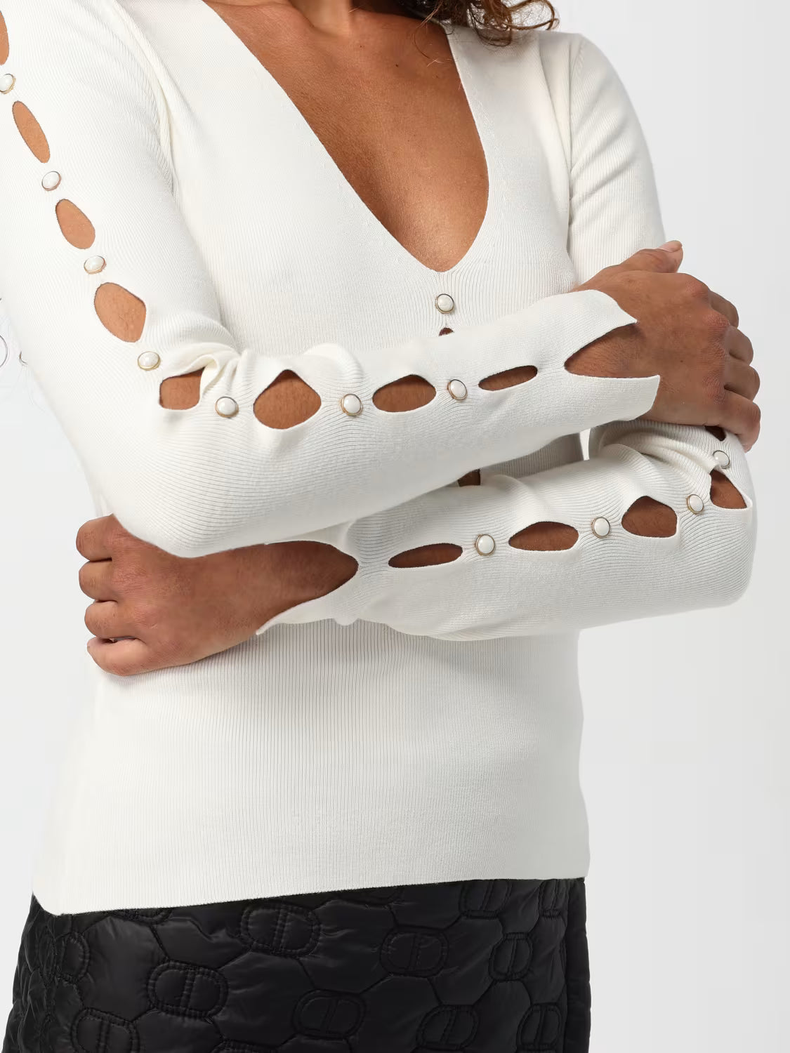 Jumper with cut-outs and studs