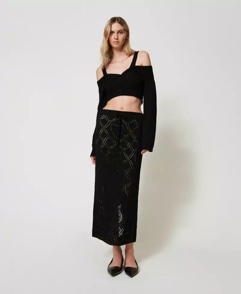 Cardigan with cable knit pattern