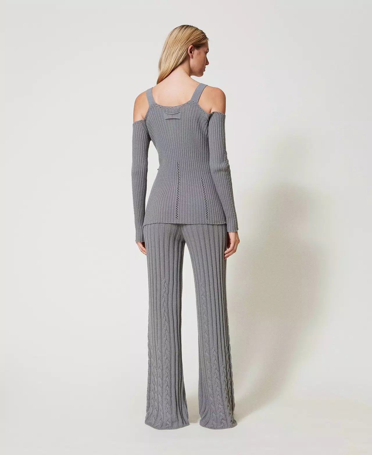 Flared trousers with cable knit pattern