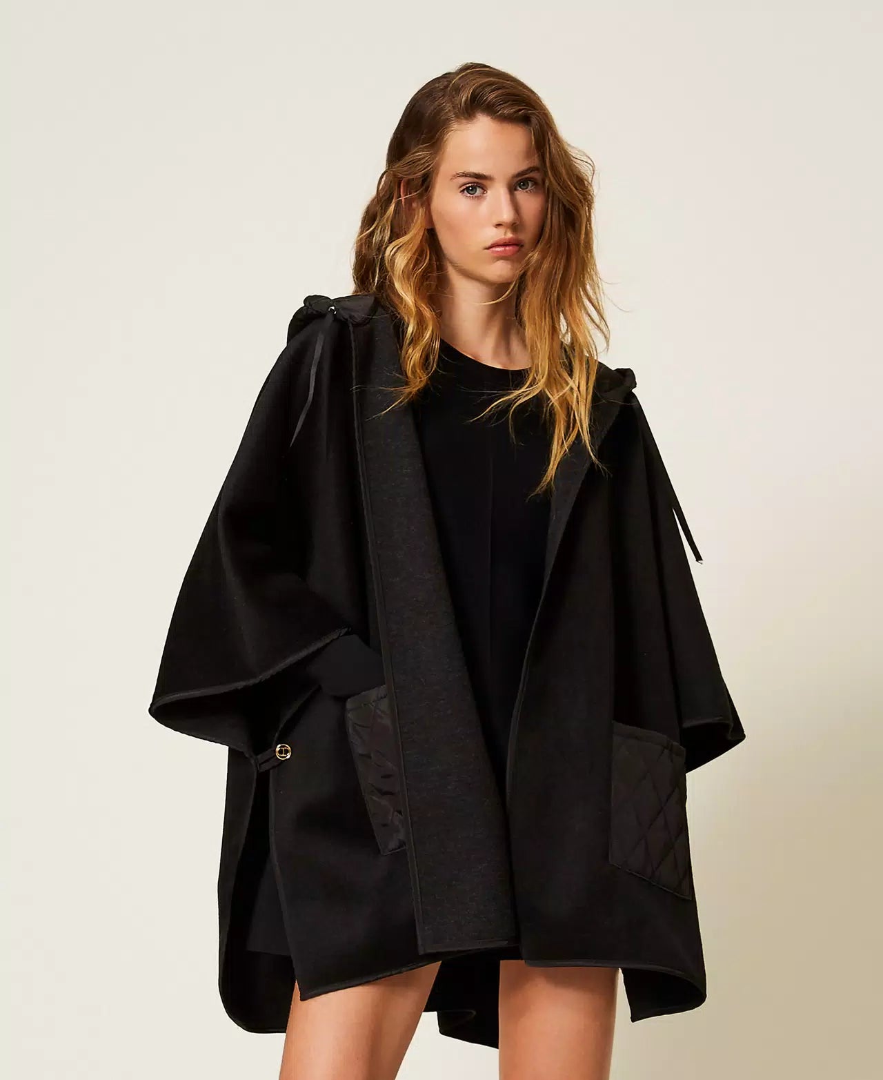 Knit poncho with pockets