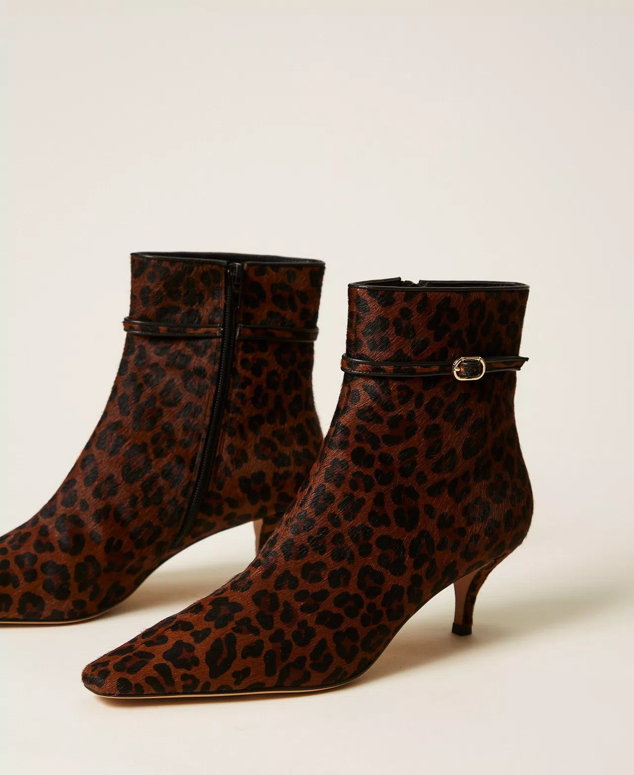 Leather ankle boots with animal print