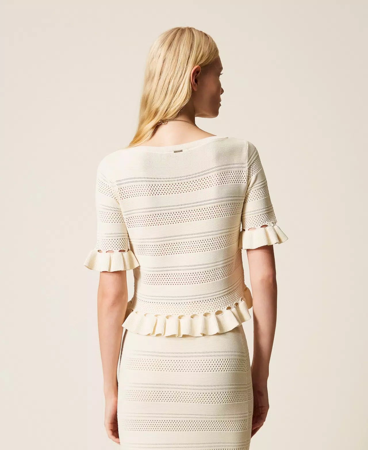 White jumper with ruffles