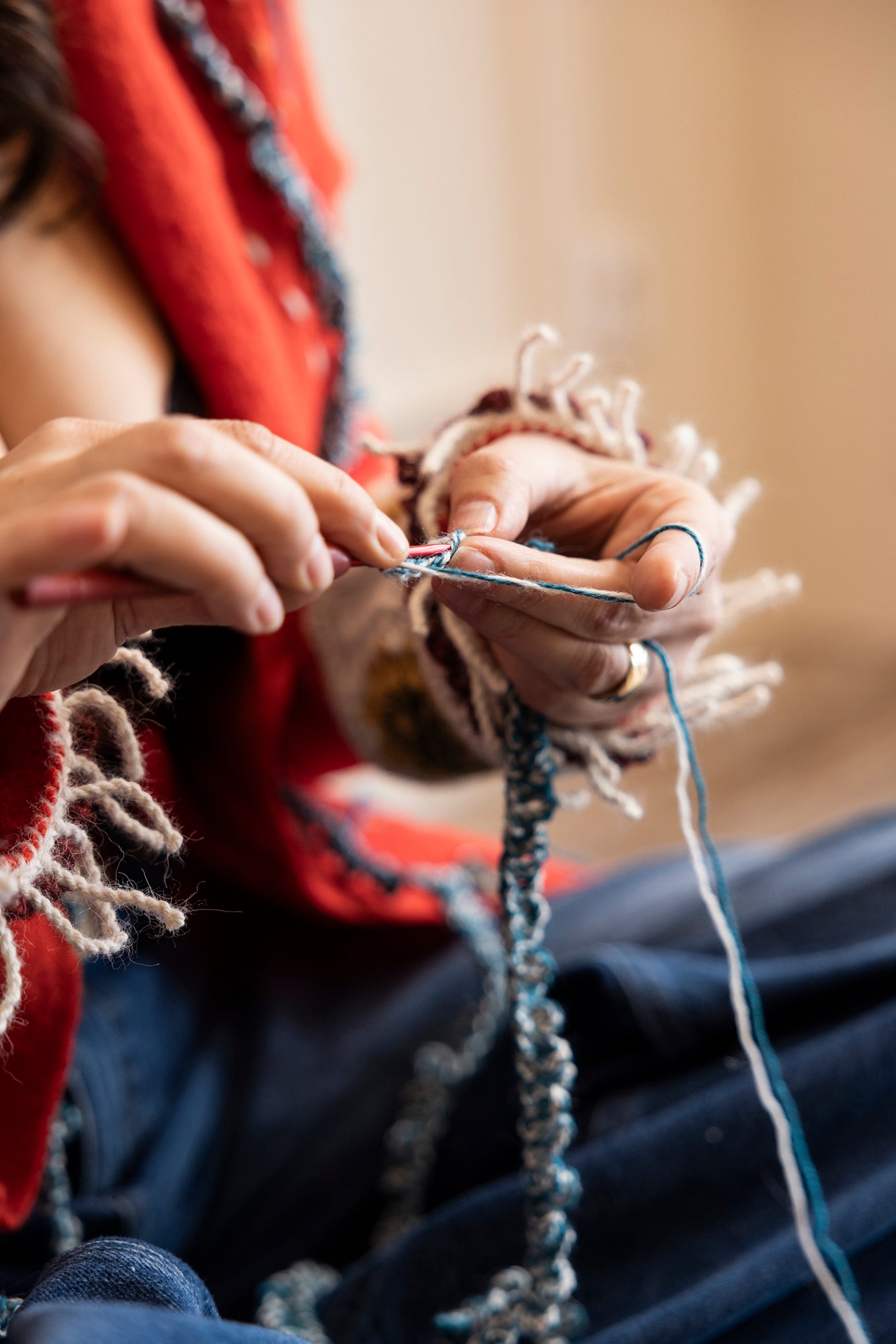 Ebru is crocheting the fringes